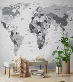 a large wall mural with the world map on it's side in grey and white