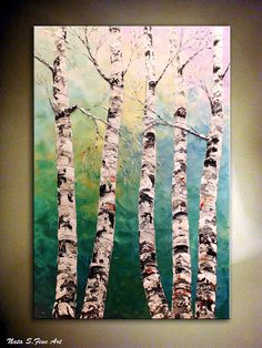 a painting on the wall of a room with white birch trees in front of it