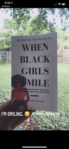 someone holding up a book in their hand with the title when black girls smile i'm smiling