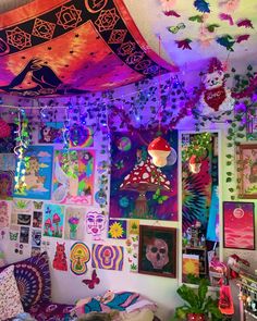 a room filled with lots of colorful art and pictures on the wall next to a bed