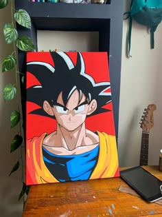 an easel with a painting of gohan on it