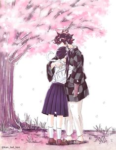 two people standing next to each other under a tree with pink flowers in the background