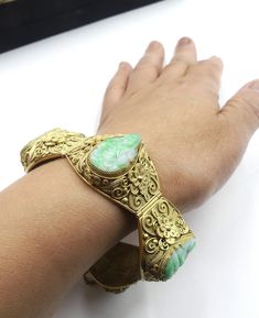 "Old Chinese gold plate silver filigree and carved jade GuanYin bracelet with original, In very good condition. Dates about 1940 's. Measures 7\" ¼ long 1\" wide and 3/8\" thick. ( 185 mm long 22 mm wide 9 mm thick ). Carved jade GuanYin 20 mm x 11 mm, 21 mm x 11 mm. 22mm x 11 mm. Weighs 61.5 gram. Stamped silver. Thanks. This item no shipping to China." Antique Carved Bangle Jewelry, Antique Rectangular Carved Jewelry, Jade Bracelet For Wedding, Antique Carved Bracelets, Antique Engraved Jade Jewelry, Vintage Carved Jade Jewelry, Carved Jade Jewelry For Wedding, Ornate Carved Ceremonial Jewelry, Carved Jade Wedding Jewelry