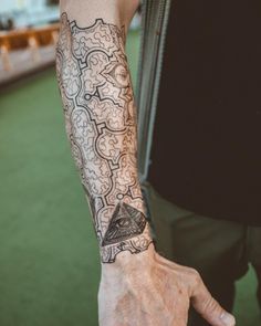 a man with a tattoo on his arm