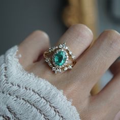 Step into a world of oceanic enchantment with our Emerald Ocean Ring, a true reminder of the tranquil sea. At its heart, a natural oval emerald takes center stage, framed by the brilliance of white diamonds and marquise diamonds. Handcrafted with meticulous attention to detail, this ring is available in your choice of 14K and 18K yellow gold, white gold, and rose gold, allowing you to select the perfect embodiment of your style and elegance. All orders come in our Tippy Taste ring box. This ring Ocean Ring, Heirloom Rings, Emerald And Diamond Ring, Marquise Diamond, Natural Emerald, Ring Band, Center Stage, White Diamonds, Ring Box