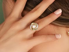 Gold Rose Twist Pearl Ring PRODUCT INFORMATION DETAİLS *Metal Type: Solid 8K/14K/18K (White/Yellow/Rose) Gold *Center Gemstone: White (Pearl quality freshwater pearls with very high luster and smooth surface.) *Pearl Size : 7 mm *Ring Weight: 3 Gram *Band Width: 2 mm *Side Stones: 1,10 mm *Ring Top Width: 1,6 cm GIFT Your product will be sent in a nice high quality jewelry box. If you have a gift note at the time of purchase, I will be happy to write it on the card. And there is more than that! Yellow Gold Birthstone Pearl Ring, Elegant Rings For Mother's Day, Elegant White Rings For Mother's Day, Elegant Diamond Rings For Mother's Day, Elegant Round Diamond Ring For Mother's Day, Elegant Rings For Anniversary And Mother's Day, Diamond Ring For Wedding On Mother's Day, Rose Gold Pearl Ring Fine Jewelry, Simple Pearl Ring