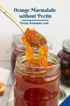 orange marmalade without pectin in a mason jar with a wooden spoon