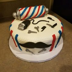 a birthday cake decorated to look like a barbershop's mustache and moustache