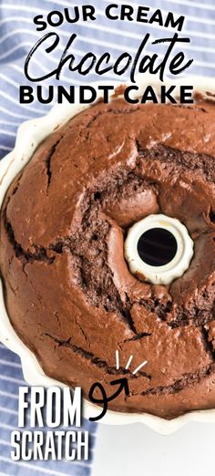 a chocolate bundt cake on a white plate with the words sour cream chocolate bundt cake from scratch