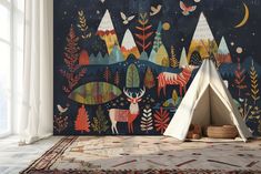 a teepee tent sitting on top of a rug next to a wall with trees and animals