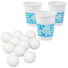 plastic cups with blue and white designs are next to large balls on a white background