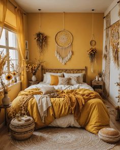 a yellow bedroom with sunflowers hanging above the bed