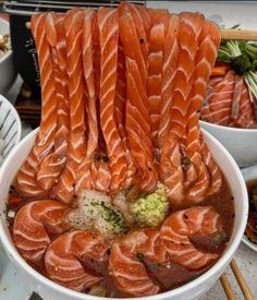 a large bowl filled with lots of sushi