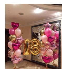 balloons are arranged in the shape of numbers and stars for an anniversary party or celebration