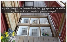 four white baskets sitting on top of a wooden porch