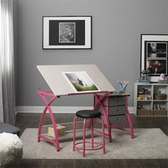 a desk with a chair and an easel in front of it on a carpeted floor