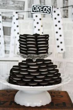 a black and white cake with oreos on top