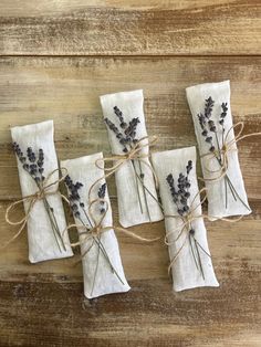 four napkins with lavender flowers tied to them