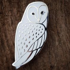 Our Barn Owl pin in a white enamel variant plated with a bright nickel finish and backed with two metal clutches to prevent spinning and for stability. 1 3/4" (45mm) tall. "Wormwood Winter Owl, Owl Brooch, Backpack Pins, Jacket Pins, Cool Pins, Enamels, Barn Owl, Cute Pins, Favorite Pins