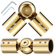 an image of some gold metal objects with screws and eyelets on white background