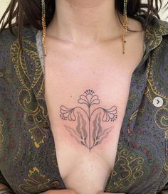 a woman with a tattoo on her chest