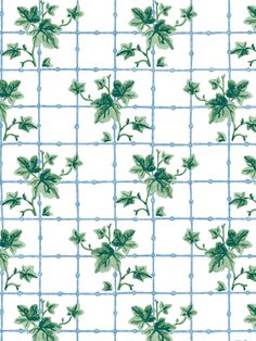 a green and white tile with leaves on it