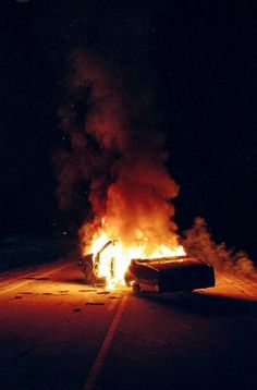 a car that is on fire in the street