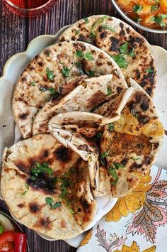 several pita breads are on a plate