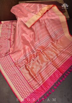 The Banarasi Silk Brocade sarees are a treasured Handloom that portray history and rich craftsmanship! This saree comes in a Peach Pink shade with gold and  Silver blending beautifully in this interweave of silk and zari! The red Kadhiyal  Border with zari makes the saree more charming. SILK MARK CERTIFIED The saree is ready to wear with falls and pico done. Hand knotted tassels add charm.  An unstitched blouse fabric is included. *Note: There may be minor variations in the shade, the texture of Transitional Slub Silk Traditional Wear With Zari Work, Festive Semi-stitched Handloom Pre-draped Saree, Semi-stitched Pre-draped Saree With Zari Weaving For Navratri, Anarkali Style Raw Silk Pre-draped Saree With Self Design, Festive Tussar Silk Pre-draped Saree For Eid, Slub Silk Pre-draped Saree With Cutdana For Navratri, Eid Semi-stitched Slub Silk Pre-draped Saree, Eid Cutdana Pre-draped Saree For Puja, Bollywood Style Pre-draped Saree With Border For Eid