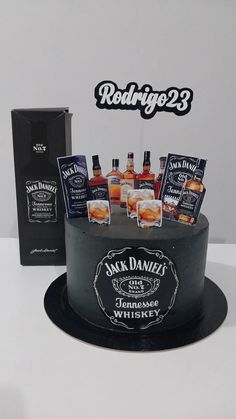 a birthday cake with bottles of whiskey on top and a card for someone's 30th birthday