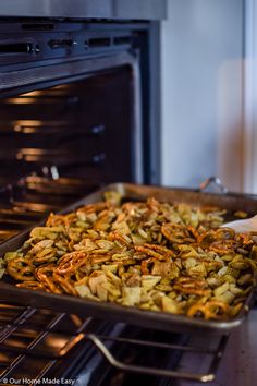 a pan filled with food sitting in front of an oven