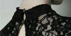 the back of a woman's black lacy top