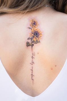 a woman with a sunflower tattoo on her back