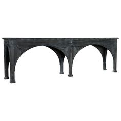 an old wooden table with arches on the top and bottom, against a white background