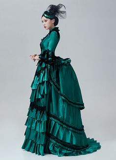 18th Century Victorian Bustle Dress Rococo Marie Antoinette Costume  Color:Green  Material: This dress made of High Quality Satin, soft,smooth and comfortable to wear  Sleeve Length:  Long Sleeve  Dresses Length:Floor Length  Neckline:  Square Collar  Decoration: Ruffles + Lace  Package Includes:  Dress + Hat    The length of skirt about 45 inches (114 cm) long from waist to hem regardless of size. This dress is pictured with a 6-hoop skirt Petticoat underneath to achieve the look. Petticoa Rococo Fashion 18th Century, Rococo Victorian Dress With Attached Cancan, Ball Gown Green, Luxury Rococo Costume Gown, Rococo Long Sleeve Costume Dress, Masquerade Party Dresses, Luxury Victorian Marie Antoinette Dress, Luxury Victorian Marie Antoinette Dress With Ruffles, Marie Antoinette Dresses