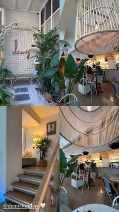 the inside of a restaurant with plants and stairs