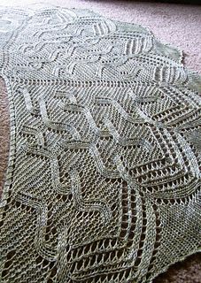 a crocheted doily is laying on the floor