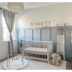 a baby's room with a crib, rocking horse and other items in it