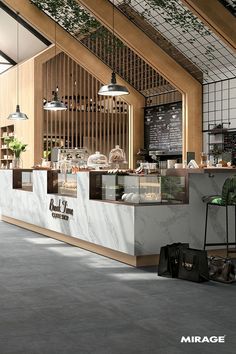 the interior of a restaurant with marble counter tops