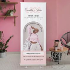 a pink and white banner stands in front of a pink wall