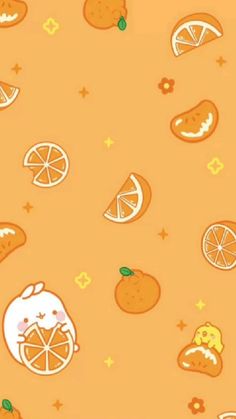 oranges and lemons are arranged on an orange background