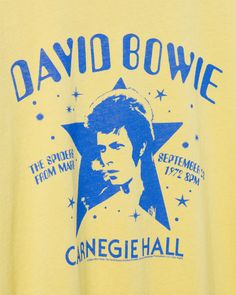 Step into the musical legacy of David Bowie with our Women's David Bowie Carnegie Hall Vintage Tee. Inspired by Bowie's iconic performance at Carnegie Hall, this distressed tee combines vintage charm with timeless rock. Snag a piece of history with a tee that pays homage to a legendary artist and the magic of this live performance. Shop the rest of our Music Collection HERE Bowie Tshirt, Rock Band Tees, Graphic Band Tees, Carnegie Hall, Vintage Band Tees, Distressed Tee, Music Collection, Vintage Rock, Live Performance