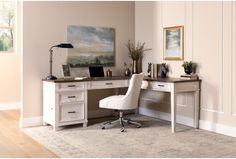 a white chair sitting in front of a desk