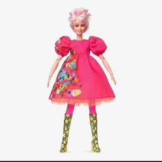 a barbie doll with pink hair and green socks on her feet, wearing a bright dress