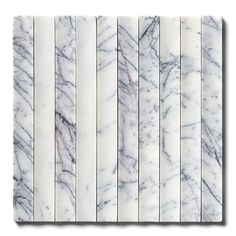 white marble tiles are lined up against each other with vertical lines in the center and bottom