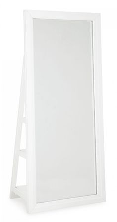 a white mirror sitting on top of a shelf