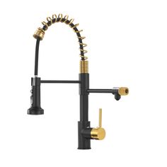 a kitchen faucet with gold spouting on the side and black handles