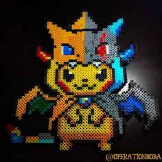 an image of a pixel art piece made out of legos on a black surface