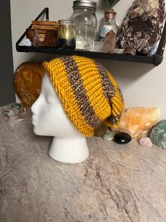 Hand stitch with heart, this slouchy beanie is the perfect blend of soft and thick.  A beautiful blend of yellow and variegated brown yarn, it's perfect for staying cozy on cold days.  -Slouchy Style -Adult Size Small -Hand knit & made in the U.S.A -Made with acrylic yarn -Fits head circumference 20in -Hand wash cold with like colors and air dry. Cozy Brown Crochet Hat With Soft Knit, Cozy Warm Brown Crochet Hat, Brown Chunky Knit Cozy Beanie, Cozy Brown Chunky Knit Beanie, Yellow Yarn Crochet Hat, Casual Yellow Crochet Beanie Hat, Casual Yellow Crochet Beanie, One Size Brown Crochet Hat With Soft Knit, Brown Knit Crochet Hat One Size