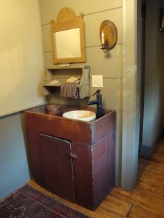 a bathroom with a sink and mirror in it